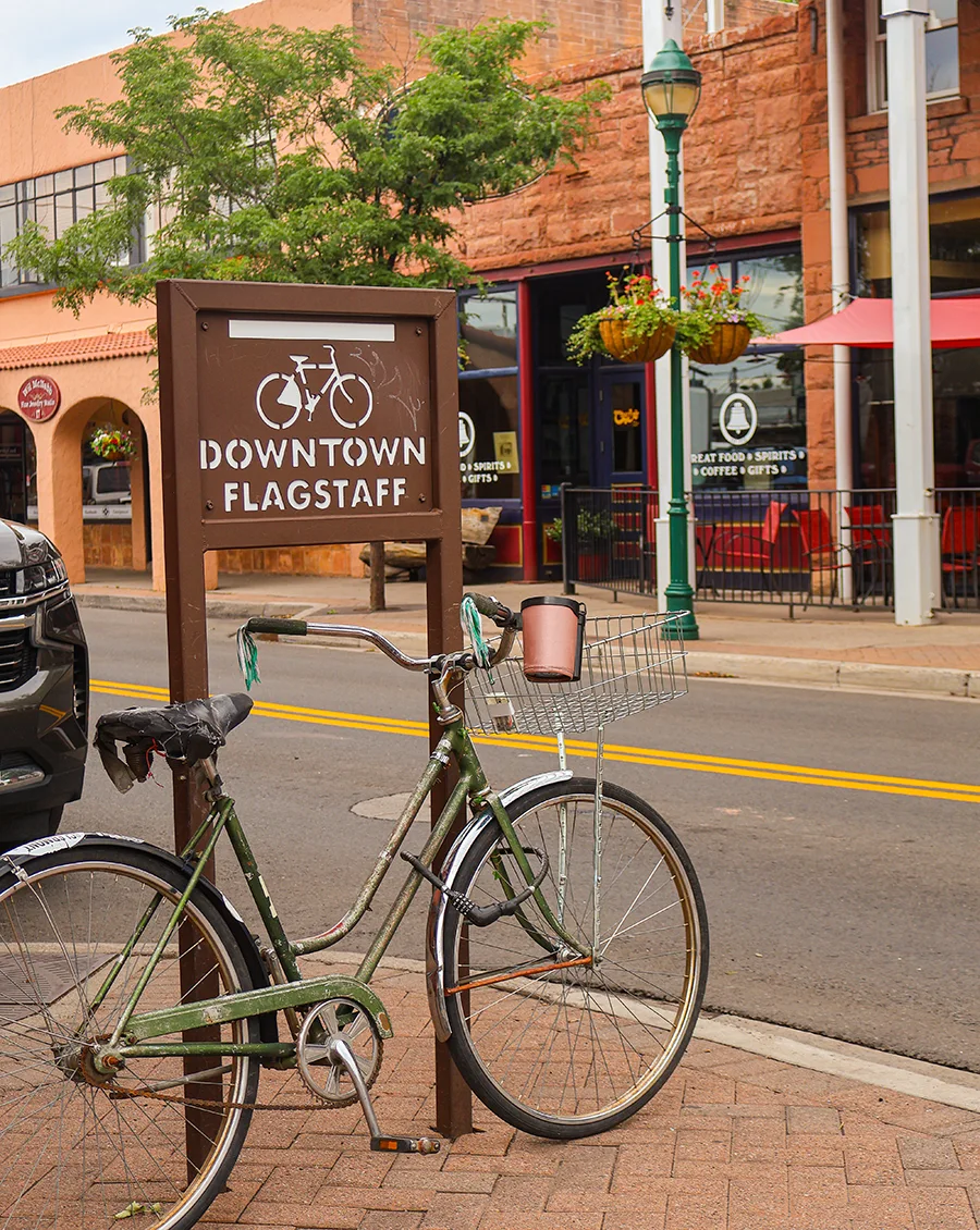 Bike parked by bike sign in downtown flagstaff